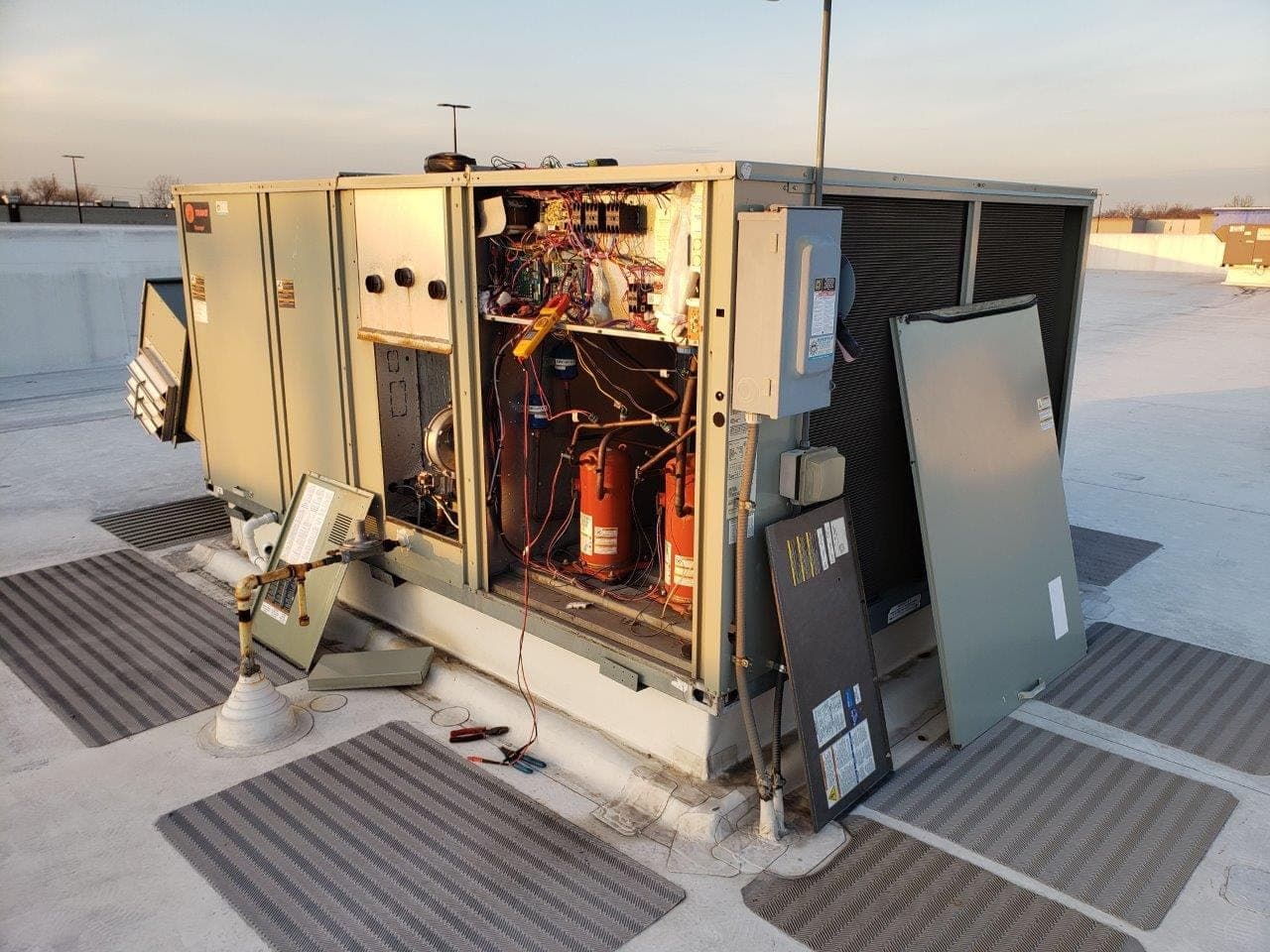 Fred repairing a commercial rooftop unit